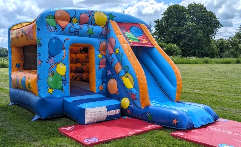 Deluxe Party Bouncy Castle with Slide Hire | GFC Leisure Bouncy Castle with Slide Hire in Harlow setup